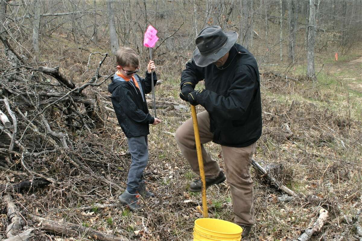Members of Big Rapids Cub Scouts Pack 3114, Boy Scouts Troop 114 and Venture Crew 2714 spent the weekend camping in the woods and planting 1600 trees on privately owned property in Rogers Heights, and participating in activities to earn merit badges.