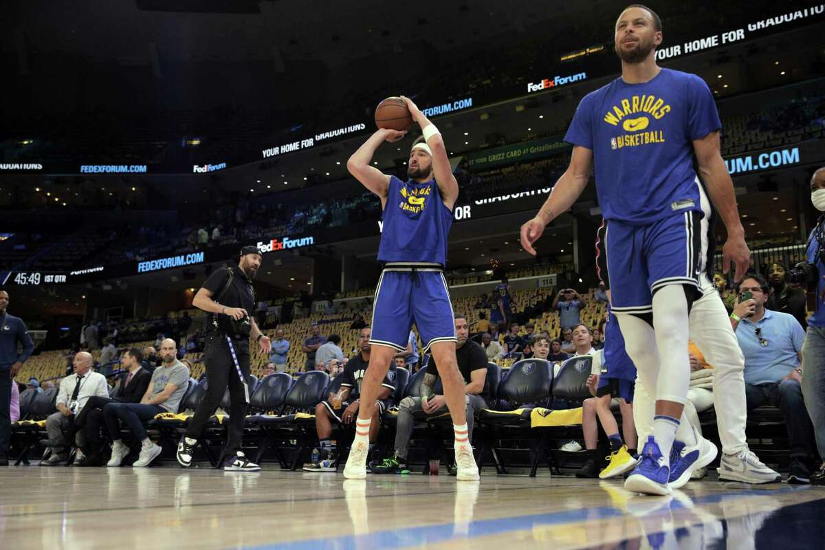 Klay Thompson (11) warms up before the Golden State Warriors played the Memphis Grizzlies in Game 1 of the second round of the NBA Playoffs at Fedex Forum in Memphis, Tenn., on Sunday, May 1, 2022.