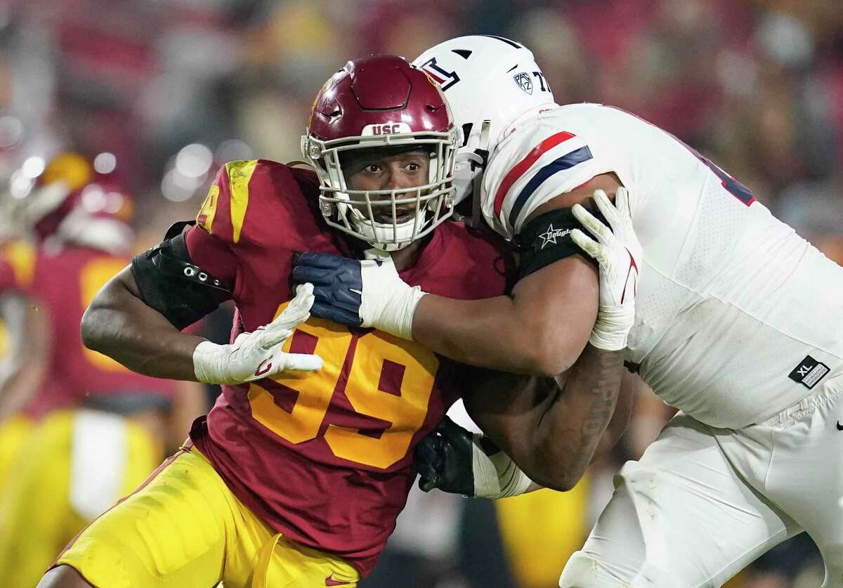 FILE - Southern California linebacker Drake Jackson (99) tries to pass-rush around the block from Arizona offensive lineman Jordan Morgan during the second half of an NCAA college football game Oct. 30, 2021, in Los Angeles. Jackson was selected by the San Francisco 49ers during the second round of the NFL draft Friday, April 29. (AP Photo/Marcio Jose Sanchez, File)