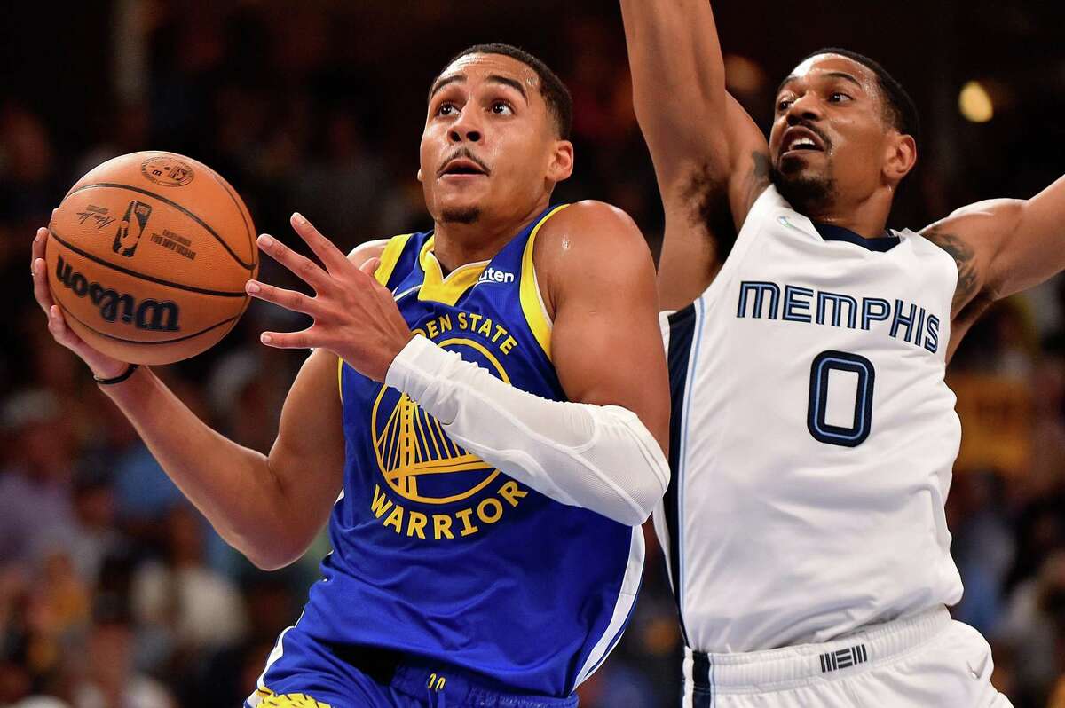 Jordan Poole #3 of the Golden State Warriors goes to the basket against De'Anthony Melton #0 of the Memphis Grizzlies during Game One of the Western Conference Semifinals of the NBA Playoffs at FedExForum on May 01, 2022 in Memphis, Tennessee.