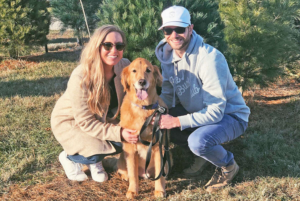Edwardsville graduate Cam Lauchner and his girlfriend, Olivia Jackson, with their dog, Palmer.