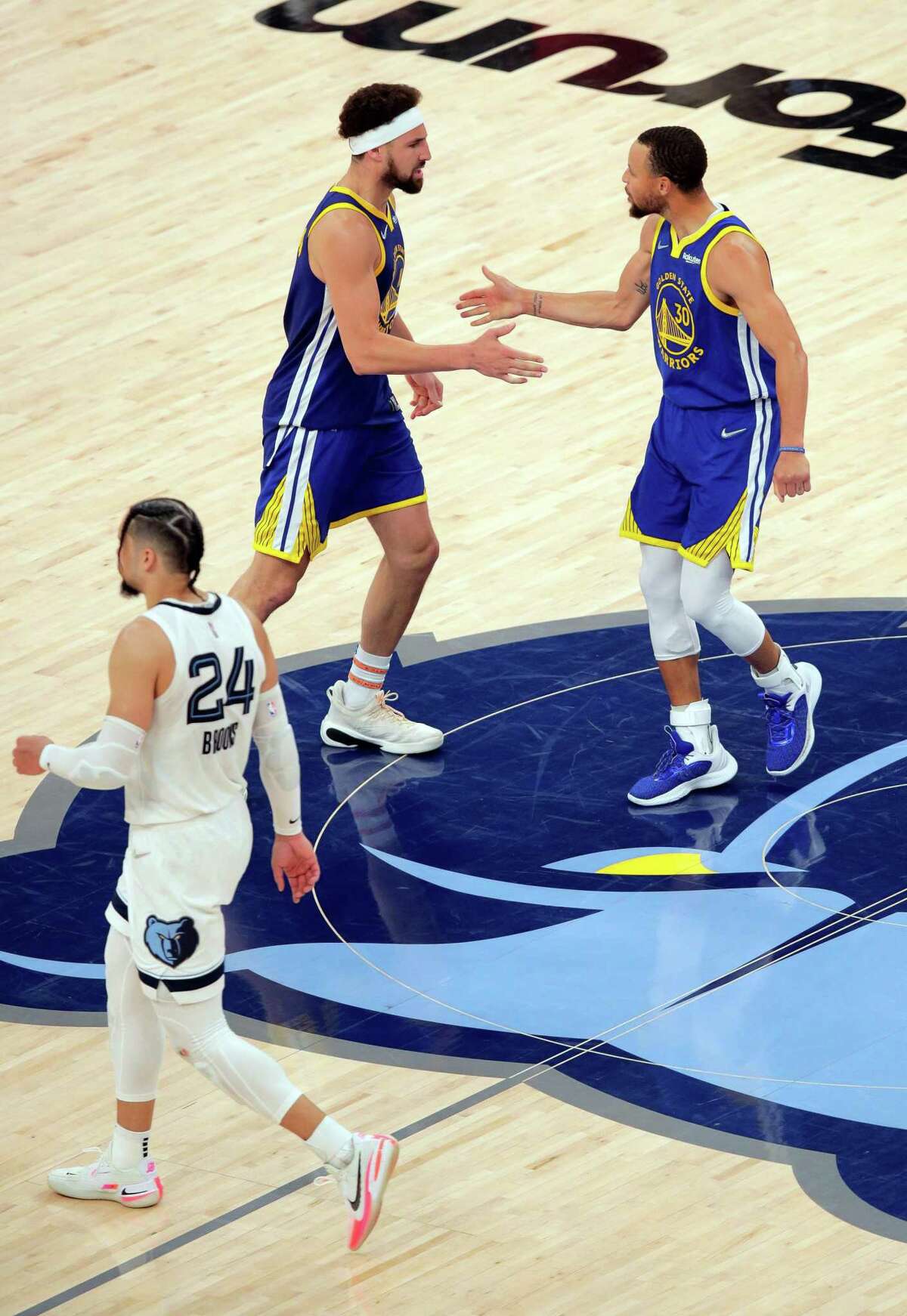 Klay Thomspon (11) and Stephen Curry (30) celebrate as the Golden State Warriors defeated the Memphis Grizzlies 117-116 in Game 1 of the second round of the NBA Playoffs at Fedex Forum in Memphis, Tenn., on Sunday, May 1, 2022.