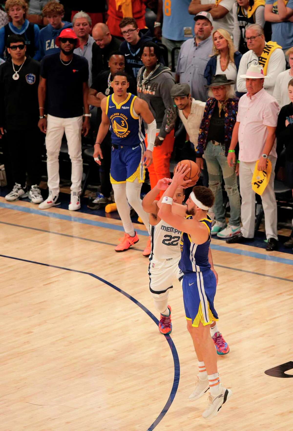 Golden State Warriors' Klay Thompson (11) shoots a 3-point basket in the second half of Game 1 of a second-round NBA basketball playoff series against the Memphis Grizzlies in Memphis, Tenn., Sunday, May 1, 2022.