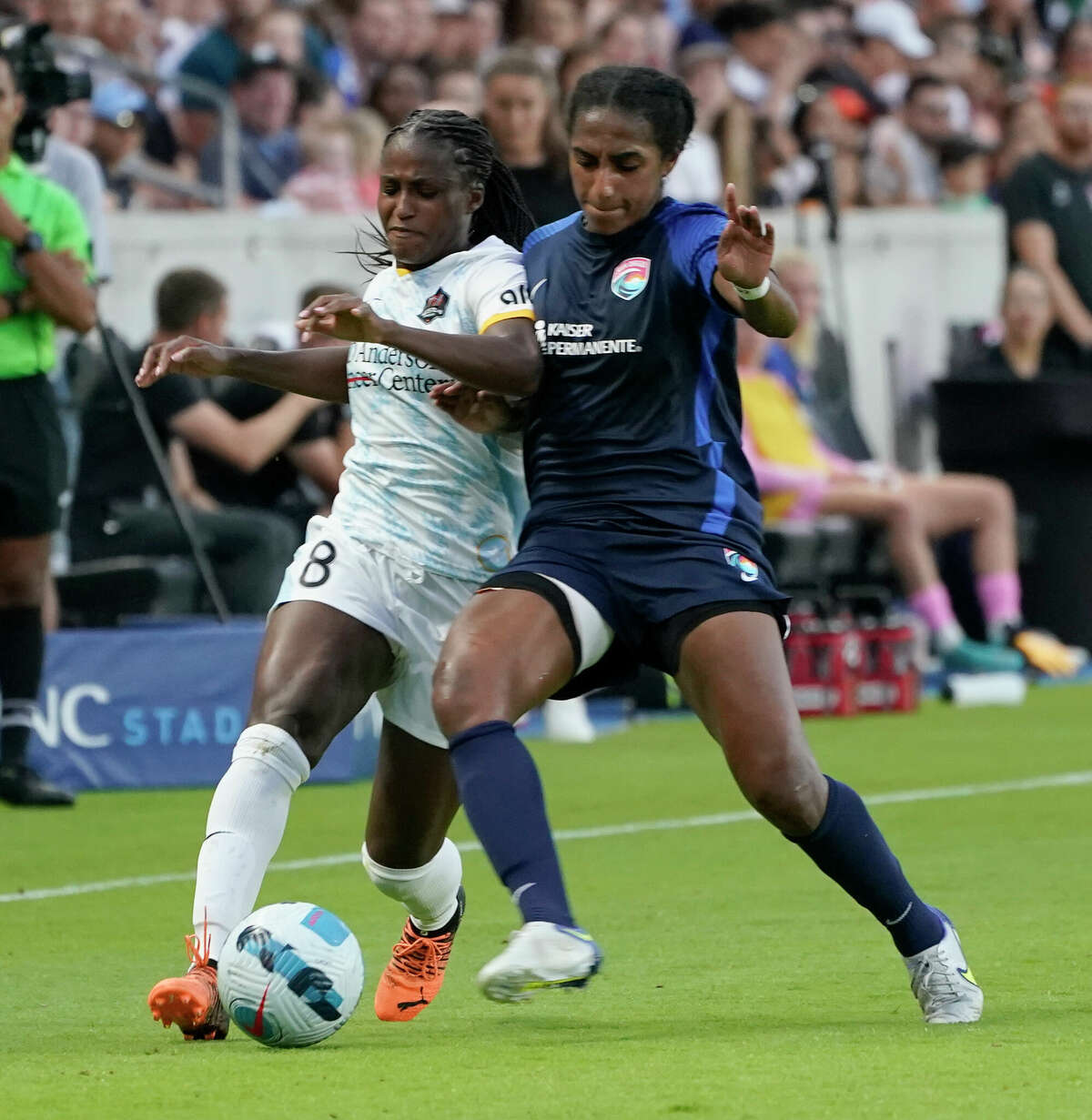 Houston Dash (8) Nichelle Prince defends the ball against San Diego Wave Naomi Girma during the second half of game at PNC Park Sunday, May 1, 2022, in Houston.