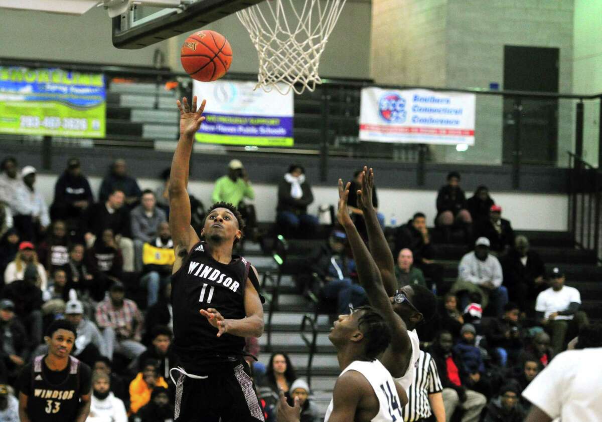 Windsor's Amir Spears (11) lays up the ball during boys high school basketball against Hillhouse in New Haven, Conn., on Wednesday Jan. 8, 2020.