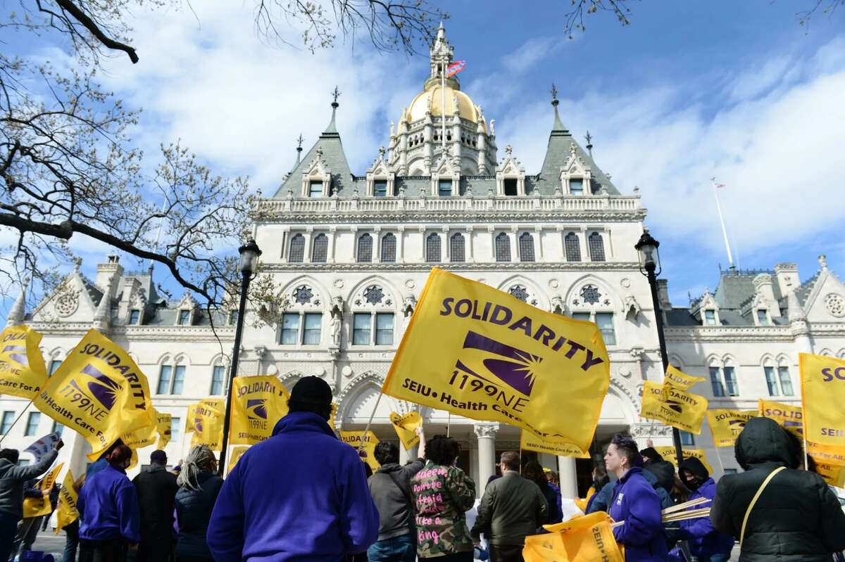 Health care workers with the SEIU 1199 New England held a rally at the state Capitol in Hartford, demanding fully funded contracts. April 28, 2022.