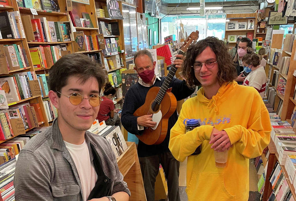 Jonathan Richman of Modern Lovers surprises customers and employees alike at Green Apple Books on April 30, 2022. Left to right: Customer Luis Gonzalez, Richman and employee Joey Goodman.