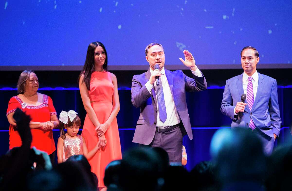 U.S. Rep. Joaquin Castro, D-Texas, speaks beside his family and his twin brother, Julian Castro, while they celebrate their 45th birthday with a free public celebration at the Tobin Center for the Performing Arts on Sept. 16, 2019.