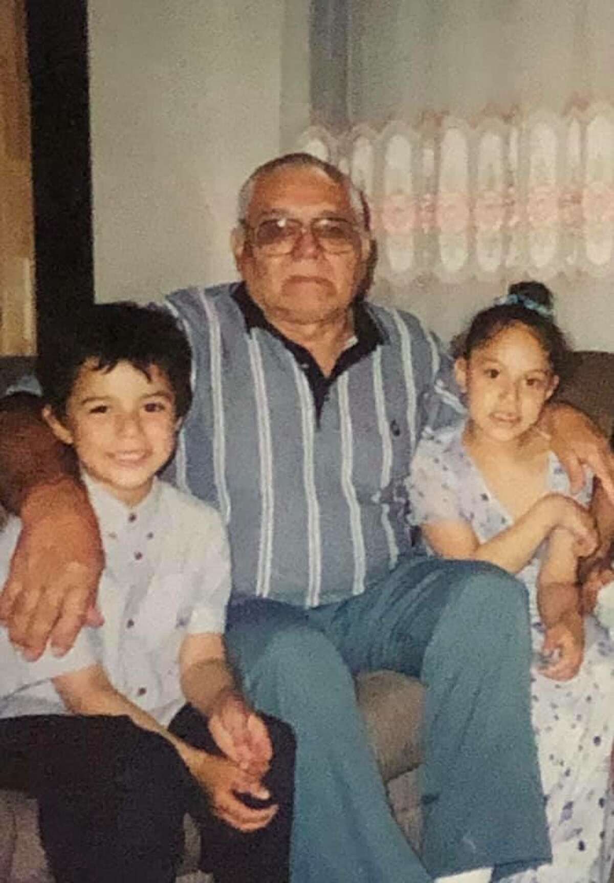 Juan Ayala with his grandfather Marcelino Guzman in the early 2000s.