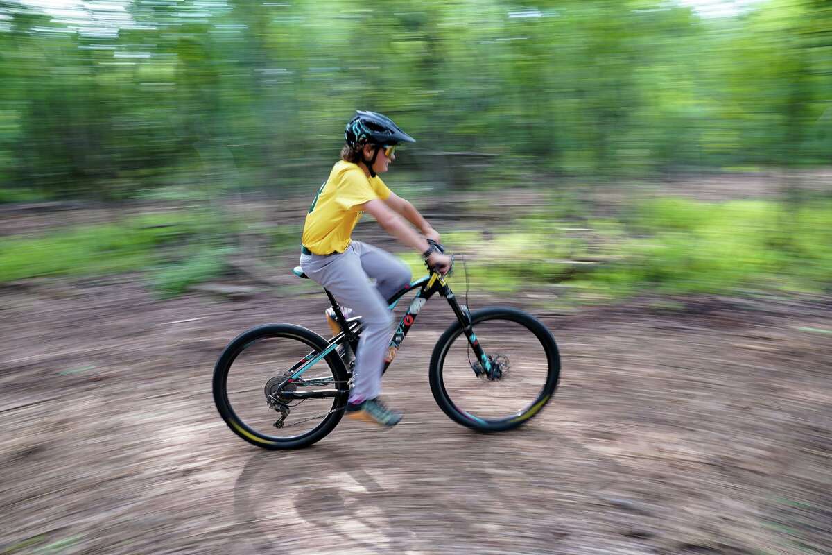 A cyclist rides the course during a groundbreaking late Sunday afternoon for the new Alamo Heights Bike Park.