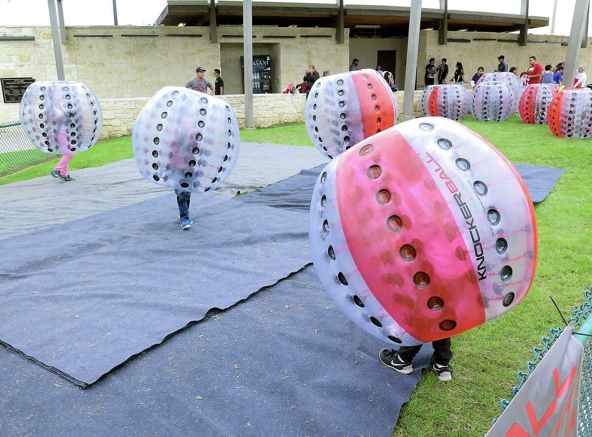 Knockerball is a new addition to the festival. Here, participants try it out at a festival in Laredo.