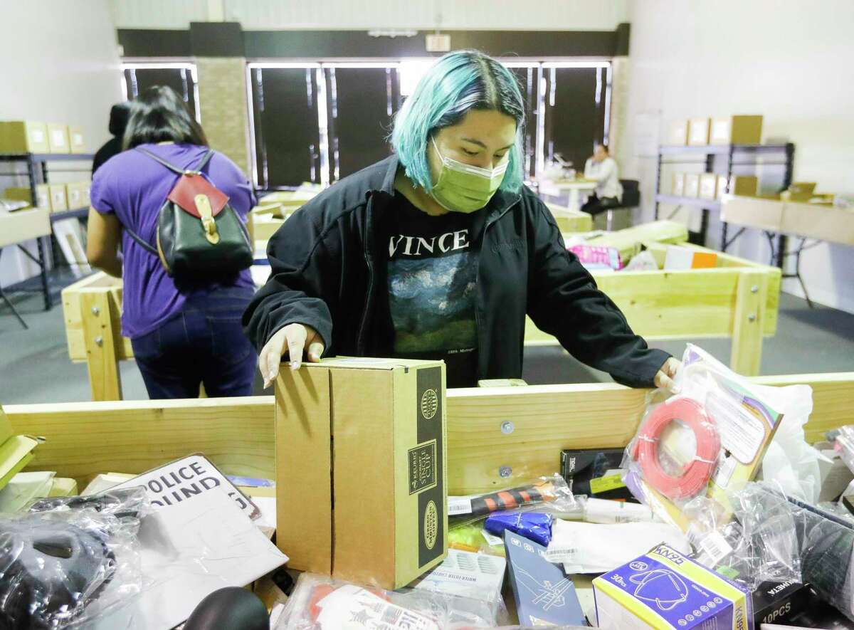 Mia Cazares looks for items at The Treasure Box, which sells overstocked items from Amazon at a discount, Wednesday, April 27, 2022, in Montgomery.