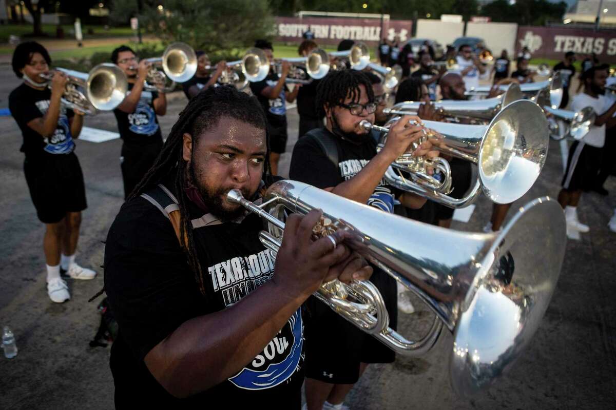 Dwayne Moore, left, and Rashad Lyons, play euphonium with the horn section as Texas Southern's Ocean of Soul prepares for the annual Labor Day Classic Tuesday, Aug. 31, 2021 in Houston. The annual Labor Day Classic football game between TSU and rival Prairie View A&M is not the only competition being waged that day. The two HBCU schools also compete at in the battle of the bands -- Ocean of Soul vs. Marching Storm.