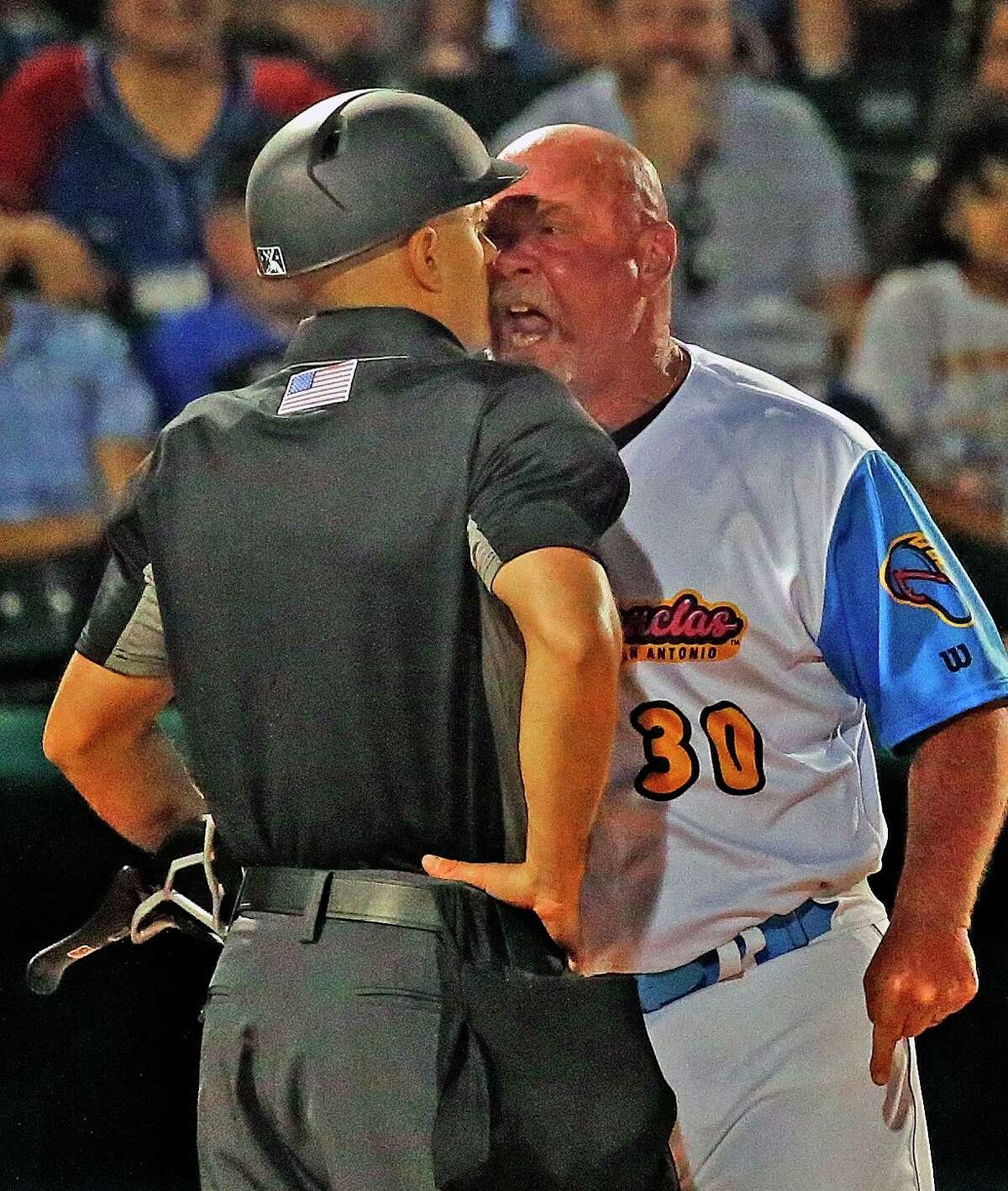 San Antonio Missions manager Philip Wellman (30) gets in the face of umpire Chris Presley-Murphy after catcher Chandler Seagle (5) was ejected in the sixth inning on Thursday, April 28,2022 at Wolf Stadium.