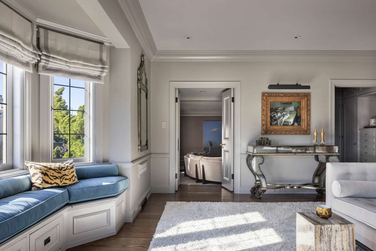 The primary bedroom features bay window looking out over the lovely views. 