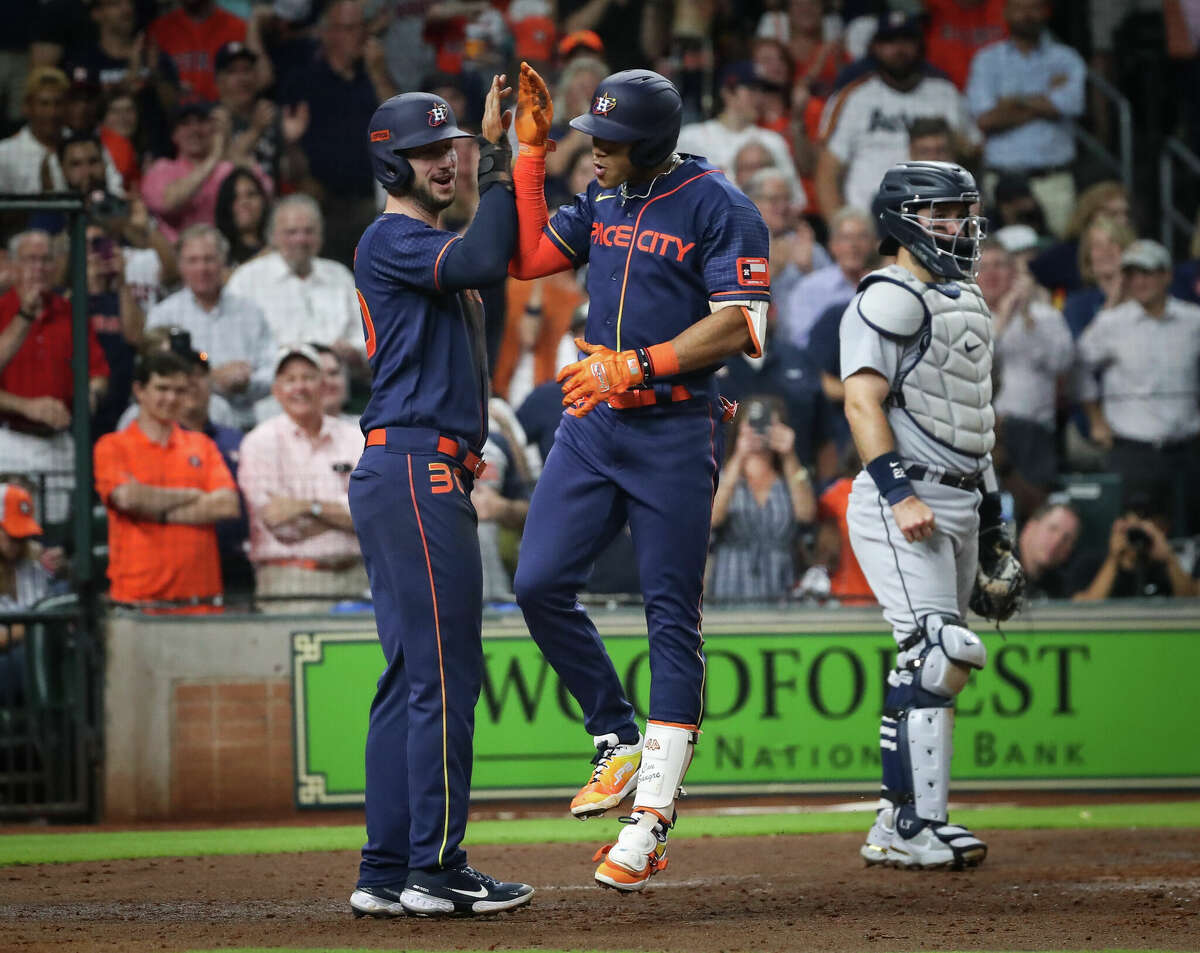 Houston Astros shortstop Jeremy Pena (3) celebrates with right fielder Kyle Tucker (30) after he hit a two-run home run during the sixth inning of an MLB game Monday, May 2, 2022, at Minute Maid Park in Houston.