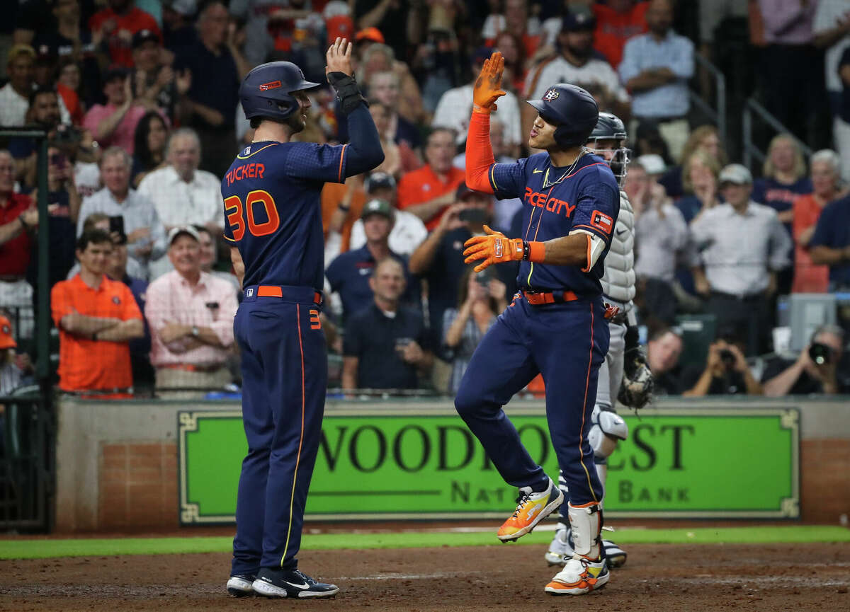 Houston Astros shortstop Jeremy Pena (3) celebrates with right fielder Kyle Tucker (30) after he hit a two-run home run during the sixth inning of an MLB game Monday, May 2, 2022, at Minute Maid Park in Houston.