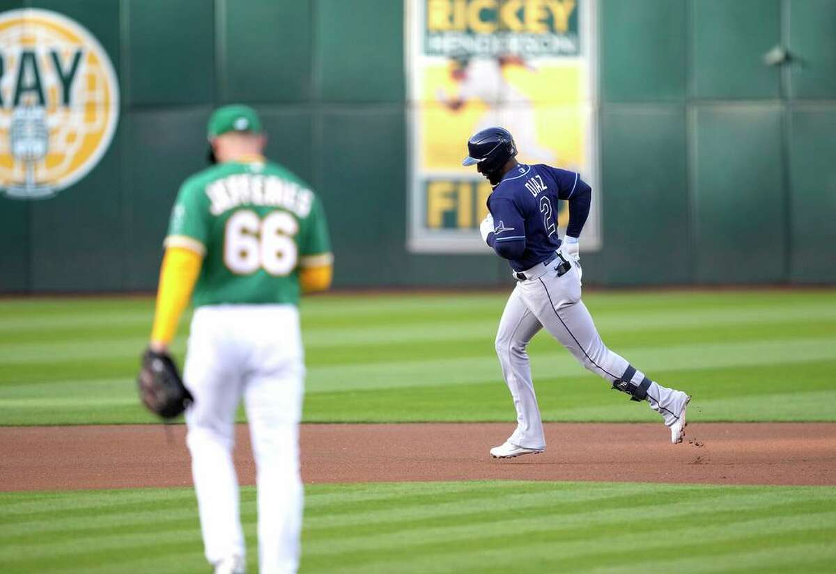OAKLAND, CALIFORNIA - MAY 02: Yandy Diaz #2 of the Tampa Bay Rays trots around the bases after hitting a lead off solo home run off Daulton Jefferies #66 of the Oakland Athletics in the top of the first inning at RingCentral Coliseum on May 02, 2022 in Oakland, California. (Photo by Thearon W. Henderson/Getty Images)
