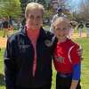 First Selectman Vicki Tesoro and Trumbull Little League softball player Victoria Dobrydney enjoy opening day.