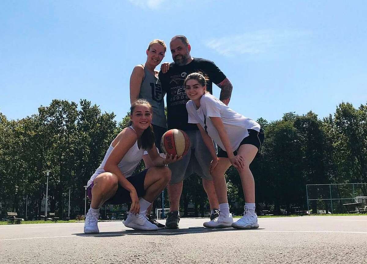 Nika (bottom right), Roberta, Darko and Hana Muhl (bottom left). Darko and Roberta played basketball before getting sidelined by injury and now both Nika and Hana compete collegiately in the United States.