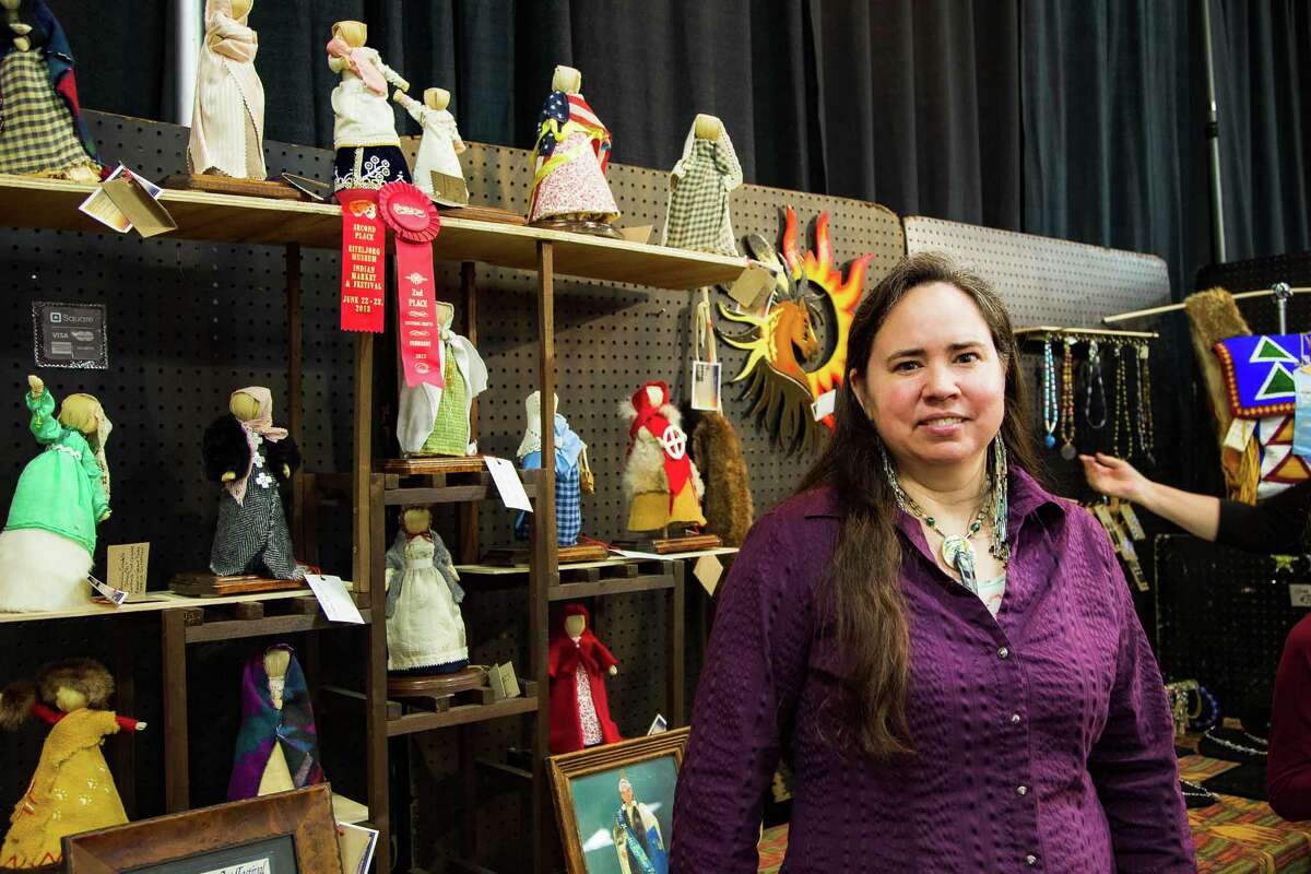 Oneida Six-Nations artist Kimberly Greene-Bugg poses with her corn husk dolls.