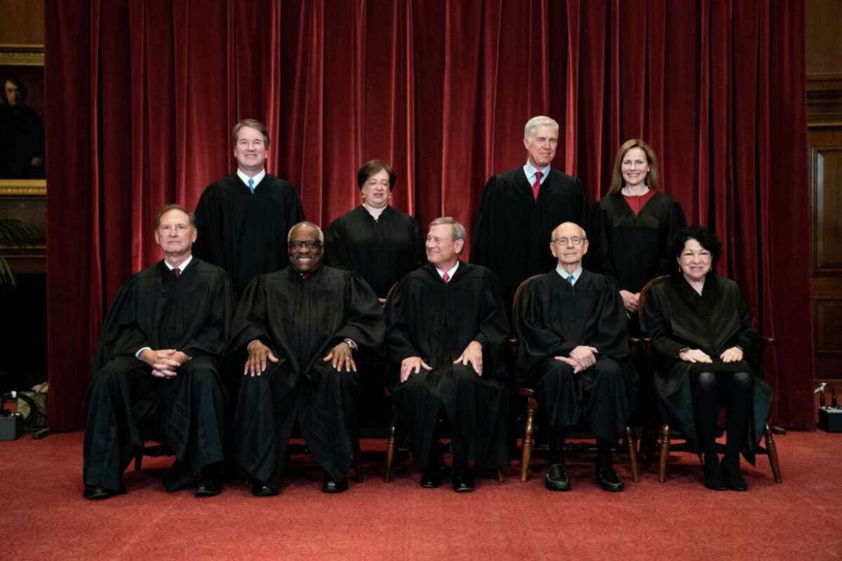 Members of the Supreme Court pose for a group photo at the Supreme Court in Washington, D.C., on April 23, 2021. Seated from left: Associate Justice Samuel Alito, Associate Justice Clarence Thomas, Chief Justice John Roberts, Associate Justice Stephen Breyer and Associate Justice Sonia Sotomayor. Standing from left: Associate Justice Brett Kavanaugh, Associate Justice Elena Kagan, Associate Justice Neil Gorsuch and Associate Justice Amy Coney Barrett.