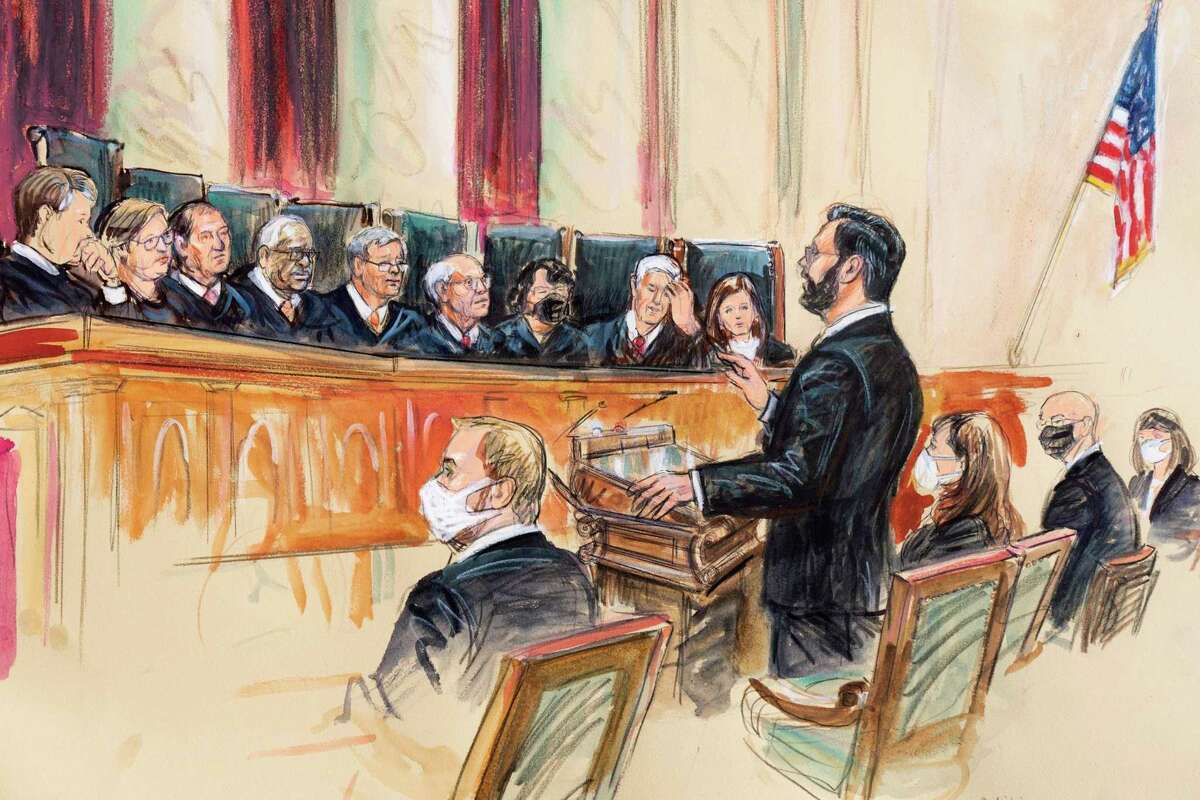 This artist sketch depicts Marc Hearron, petitioner for Whole Woman's Health, standing while speaking to the Supreme Court, Monday, Nov. 1, 2021, in Washington.