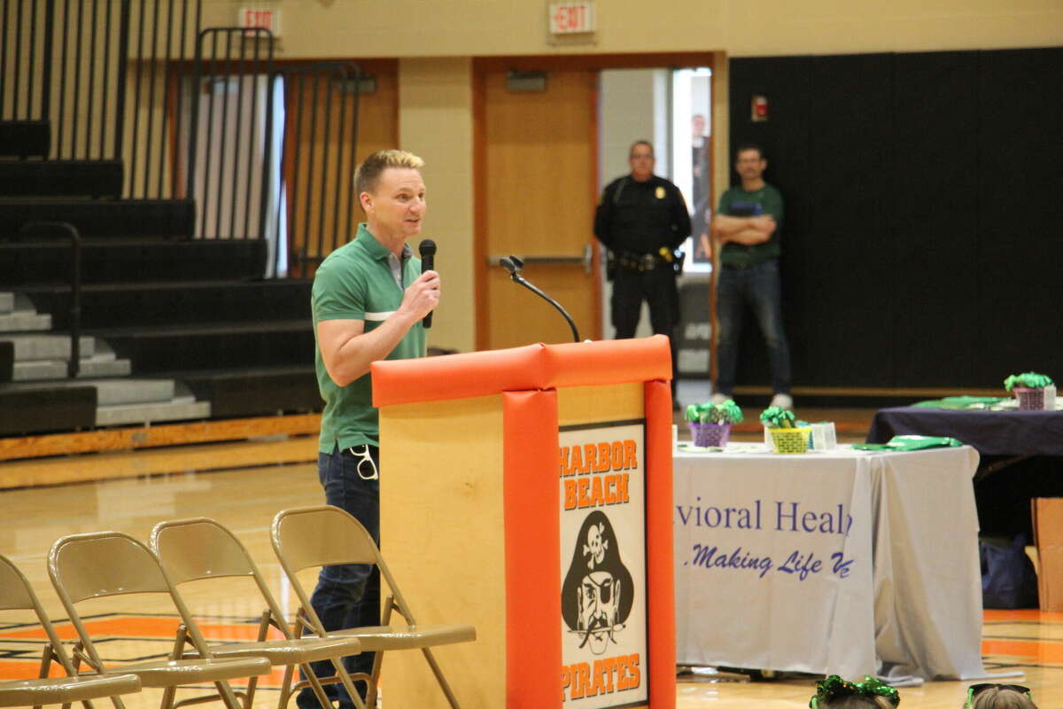Superintendent Dr. Shawn Bishop takes to the podium at a suicide awareness march in 2022.