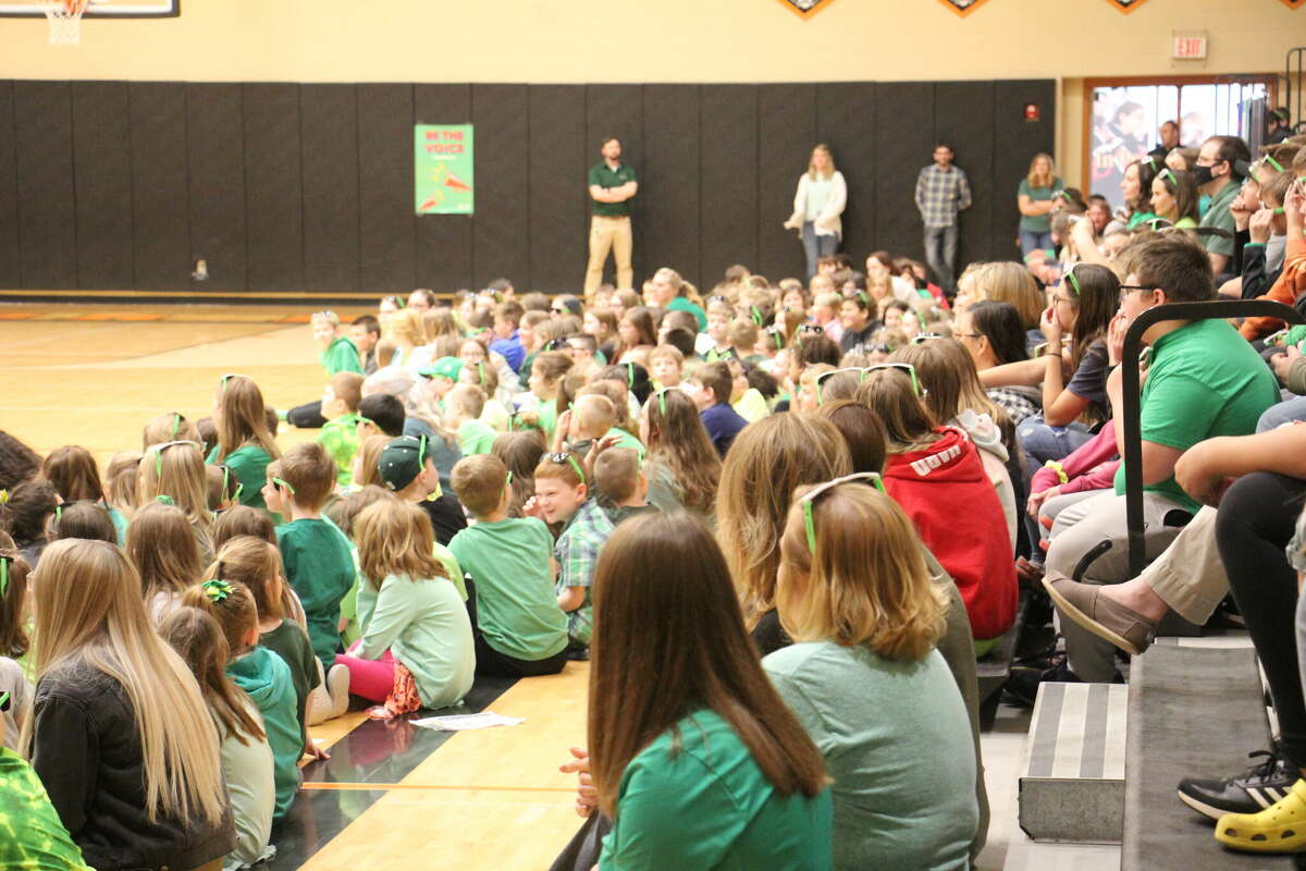 Kids of every age gather in the high school gym to learn about the importance of mental health.