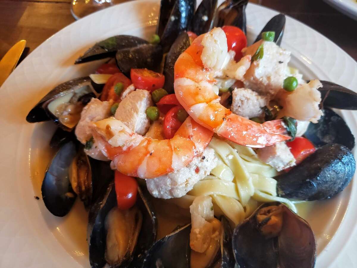 Prawns, mussels and swordfish were mixed with fresh fettuccine, peas, fresh tomatoes, basil and garlic at Via Sforza in Westport.