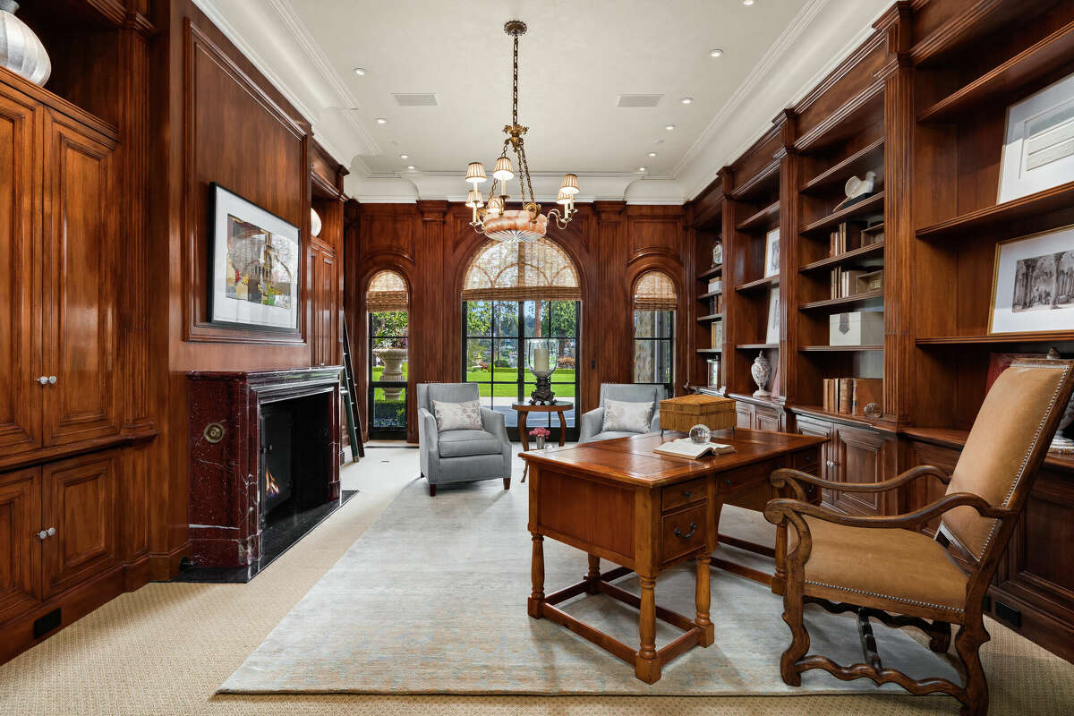A tycoon needs an office, and the home offers this one, with dark wood and built-ins.