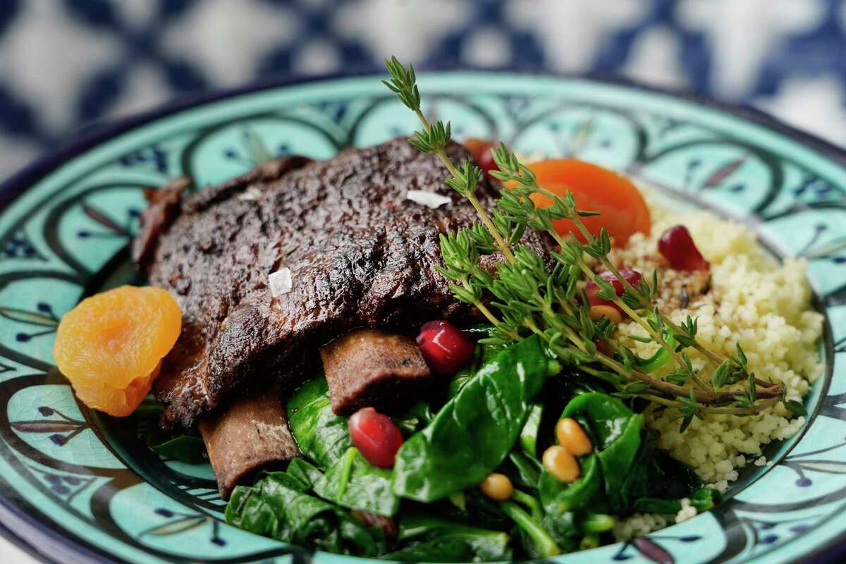 lamb spare ribs served with couscous, spinach and apricots at Hamsa, the modern Israeli restaurant opening May 11 at 5555 Morningside in Rice Village.