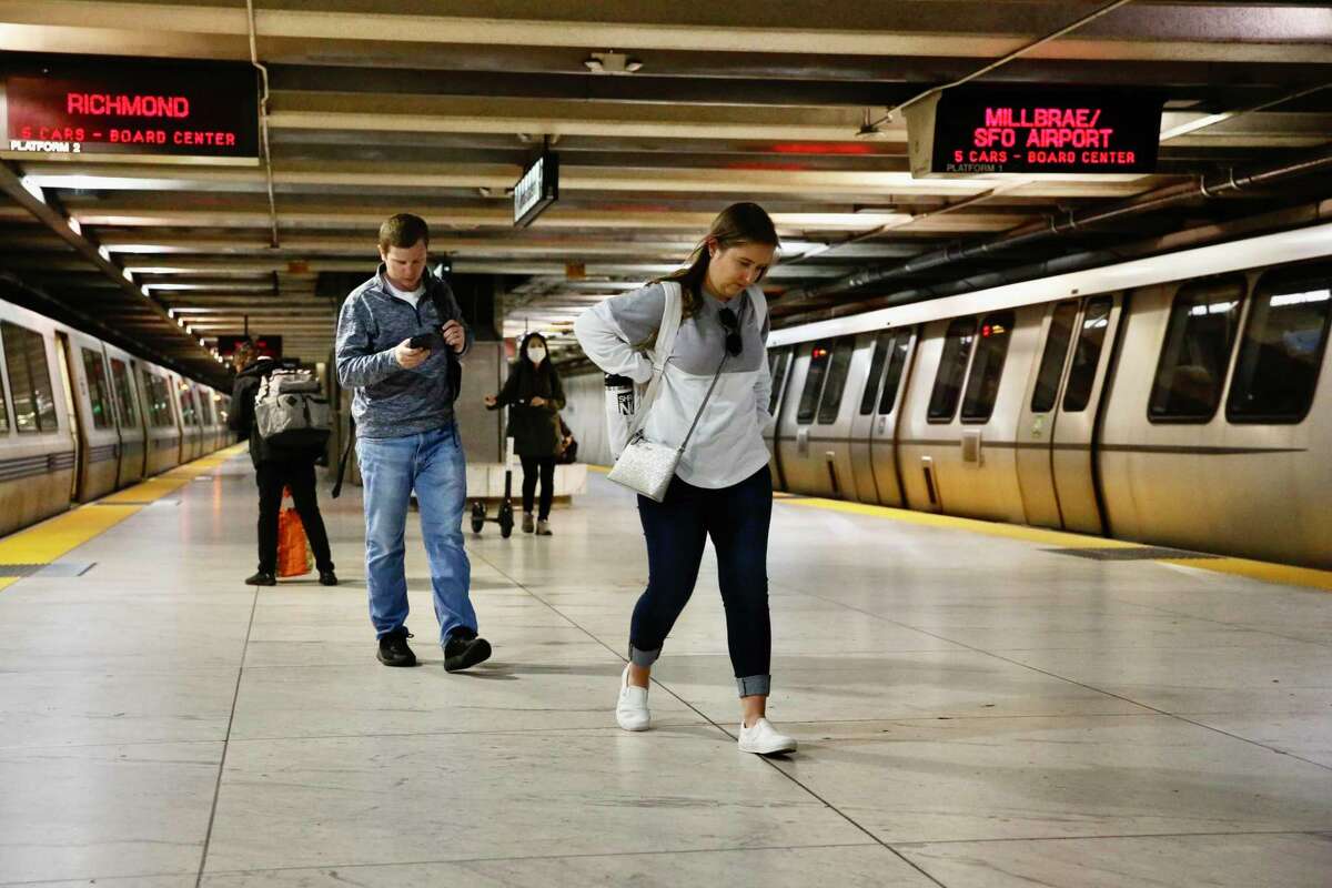 COVID cases and hospitalizations in the Bay Area rise as new COVID infections in the region swell by 167% in a month. Passengers transfer between BART trains in San Francisco on April 19, 2022.