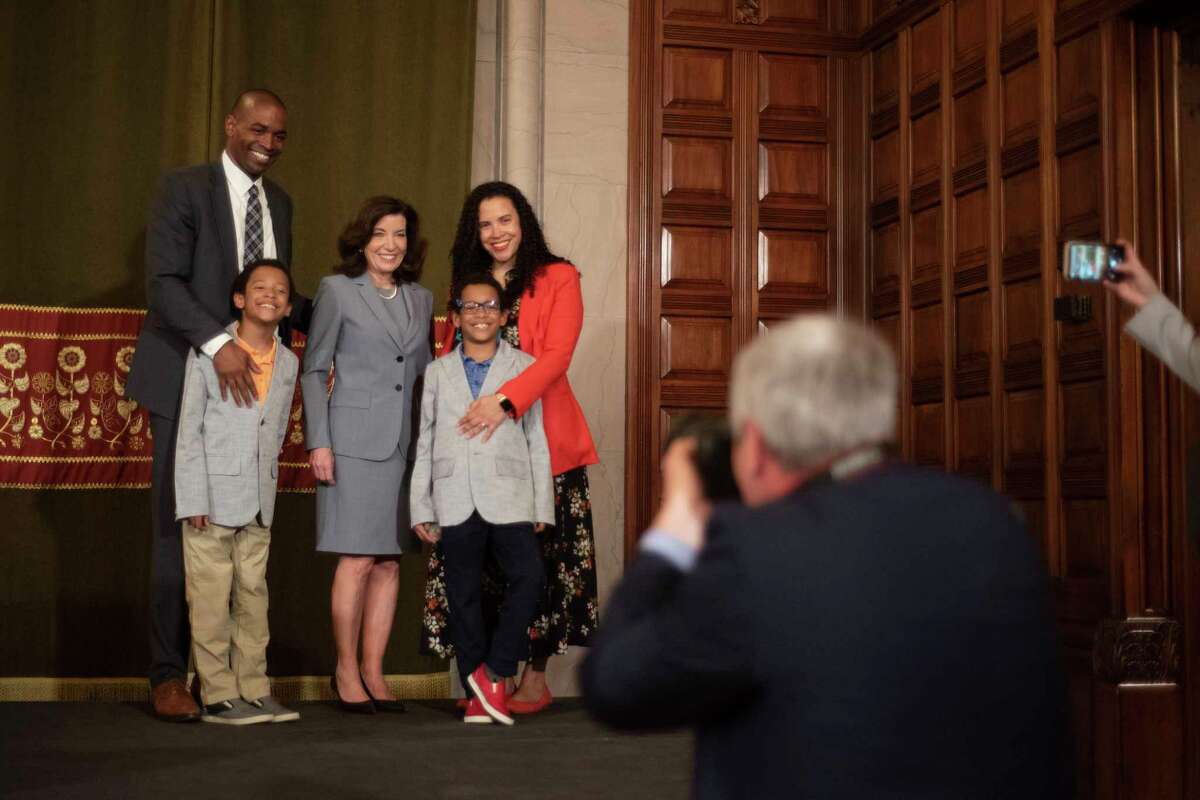 Lt. Gov Antonio Delgado, left, and his wife Lacey, far right, along with their twin boys, Maxwell and Coltrane, pose for a photo with Gov. Kathy Hochul following an announcement a year ago that he would become the lieutenant governor. (Paul Buckowski/Times Union)