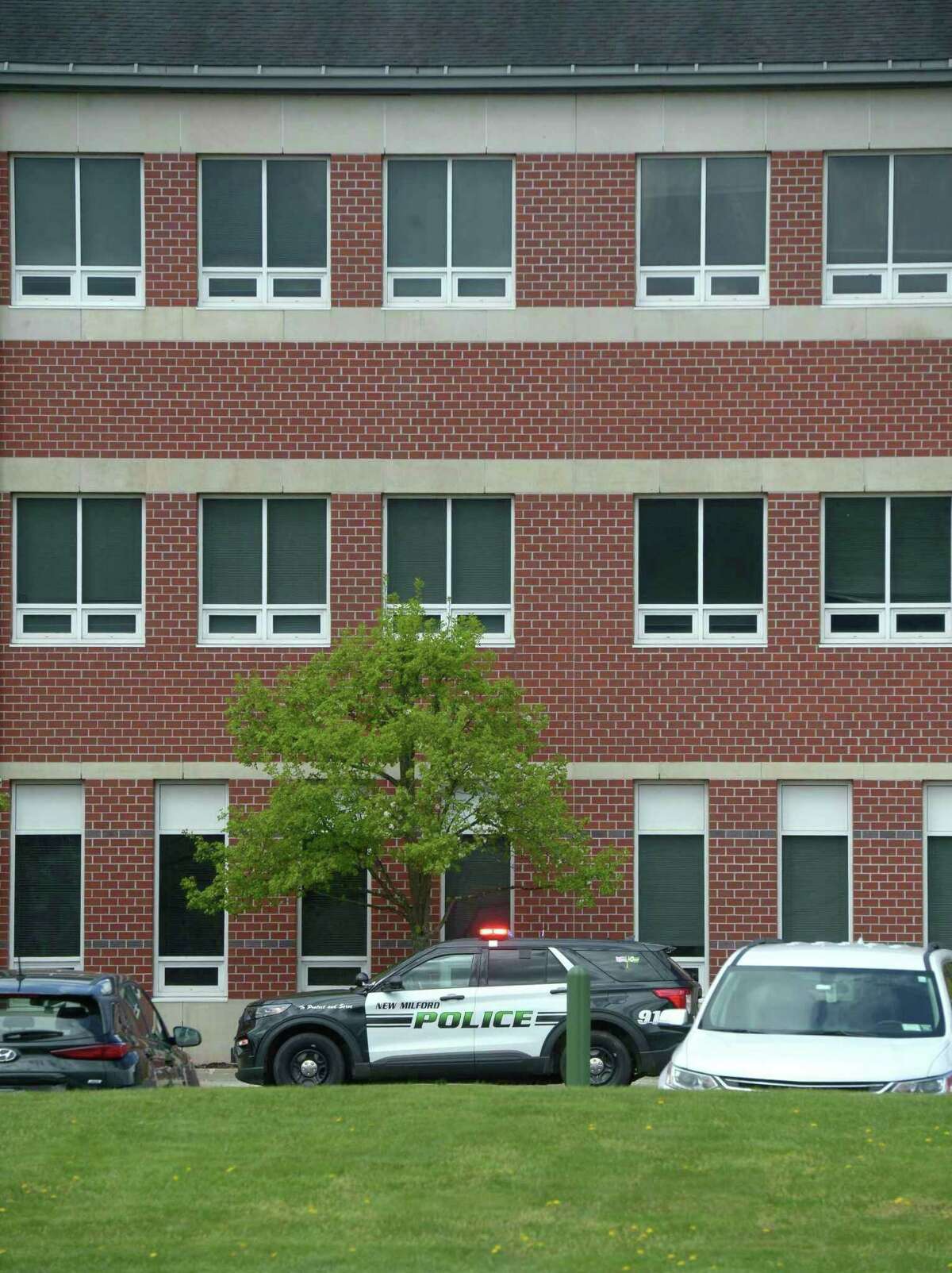Police vehicle in front of New Milford High School, Wednesday, April 27, 2022.