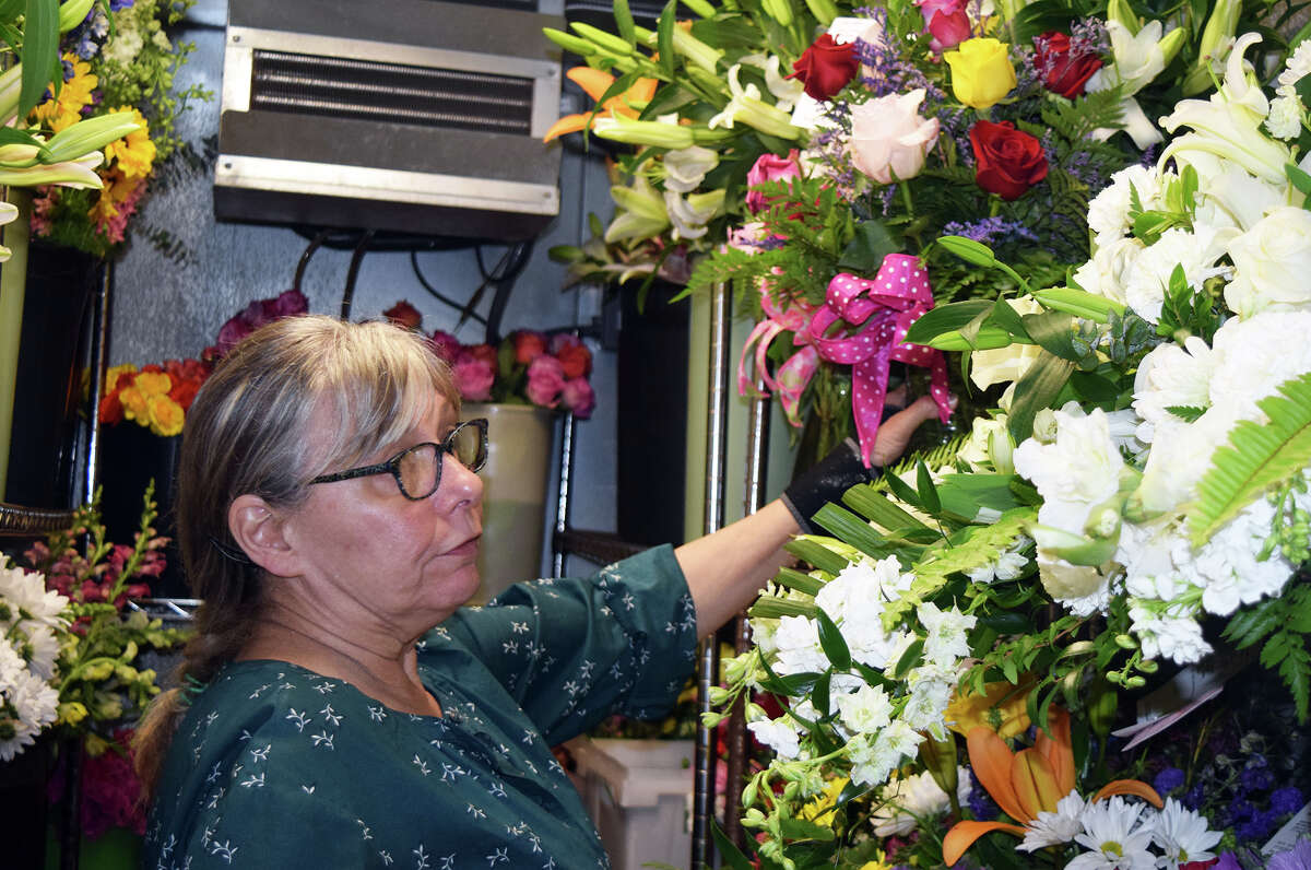 Pam Haug-Ciaccio creates bouquets and corsages at All Occasions Flowers and Gifts. She was working Tuesday at the florist at 229 S. Main St. to prepare Mother's Day arrangements. Mother's Day is Sunday.