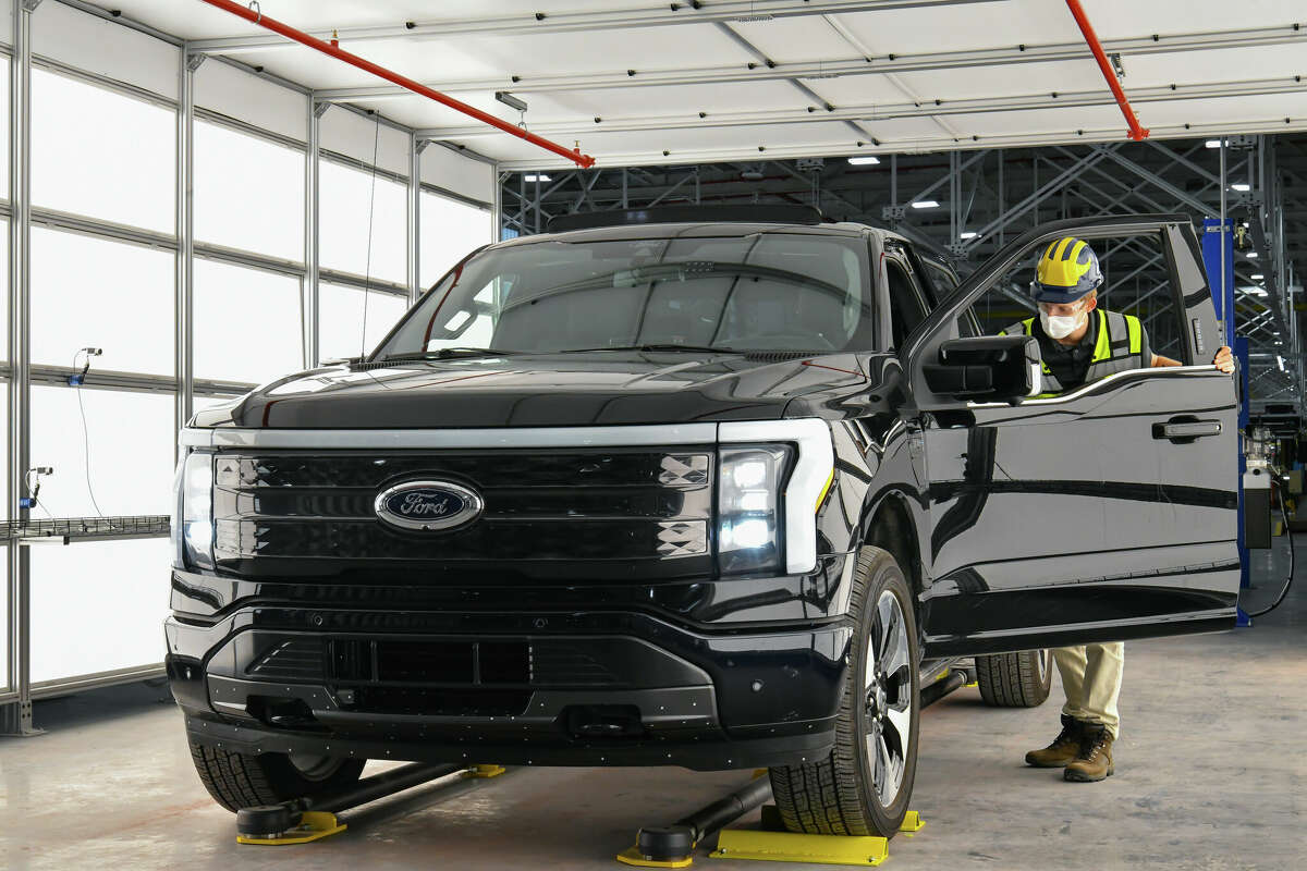 One year after Ford confirmed construction of the Rouge Electric Vehicle Center in Dearborn, Mich., the first Ford F-150 Lightning pre-production units begin leaving the factory. Pre-production model shown. F-150 Lightning available starting spring 2022.