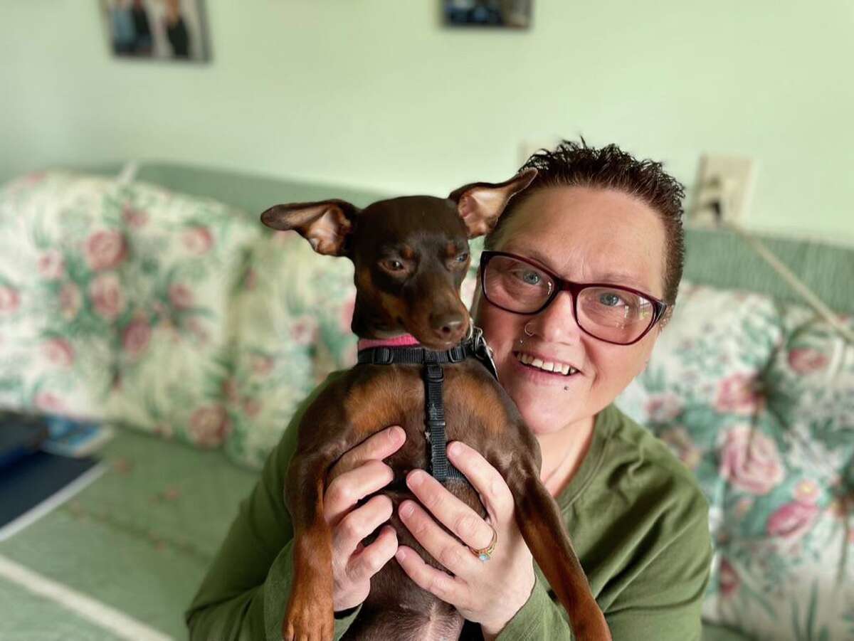 Leigh Ann Carmona Diaz with her dog, Sophie.