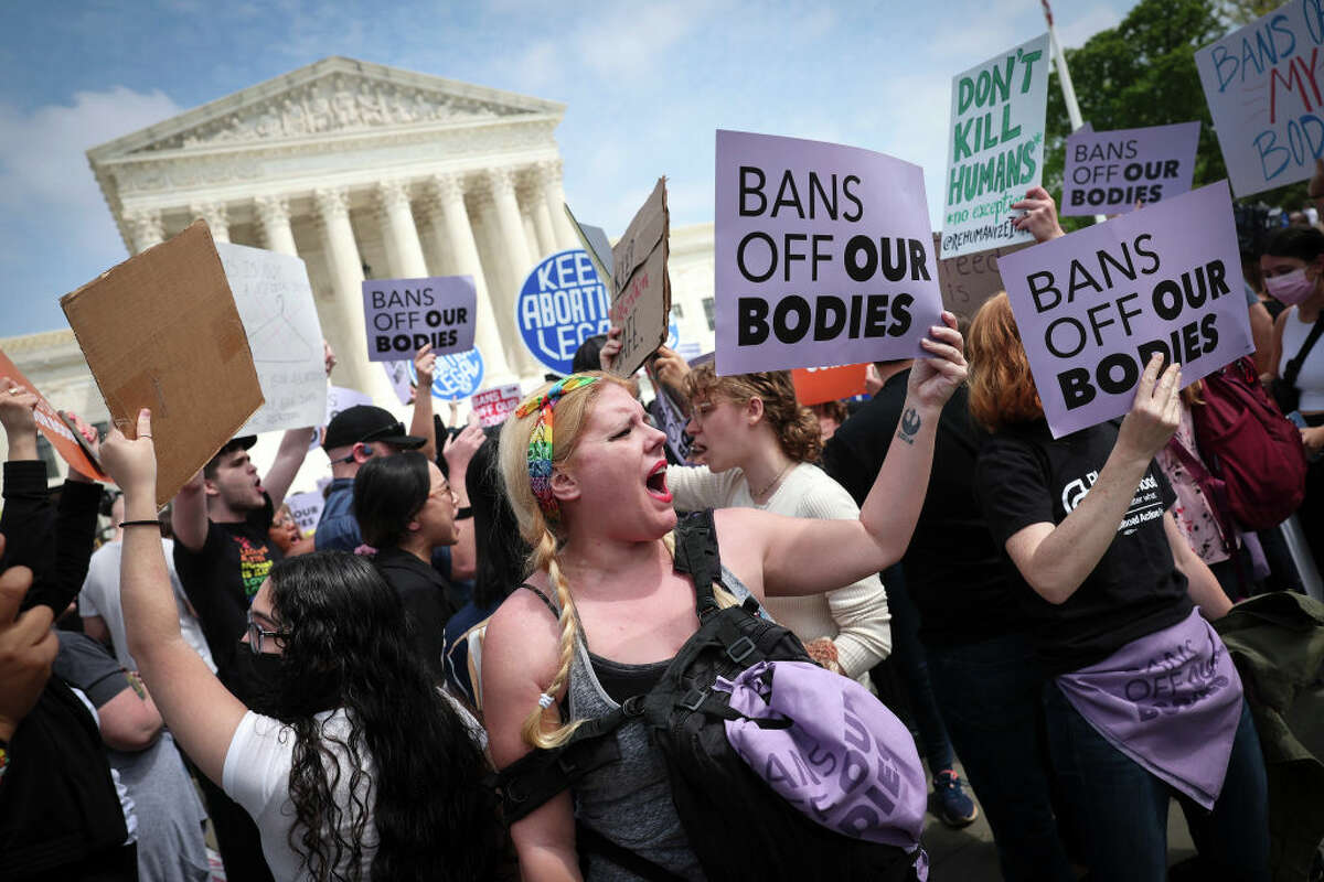 Pro-choice activists took to the front of the Supreme Court building on Tuesday to protest plans to overturn Roe v. Wade