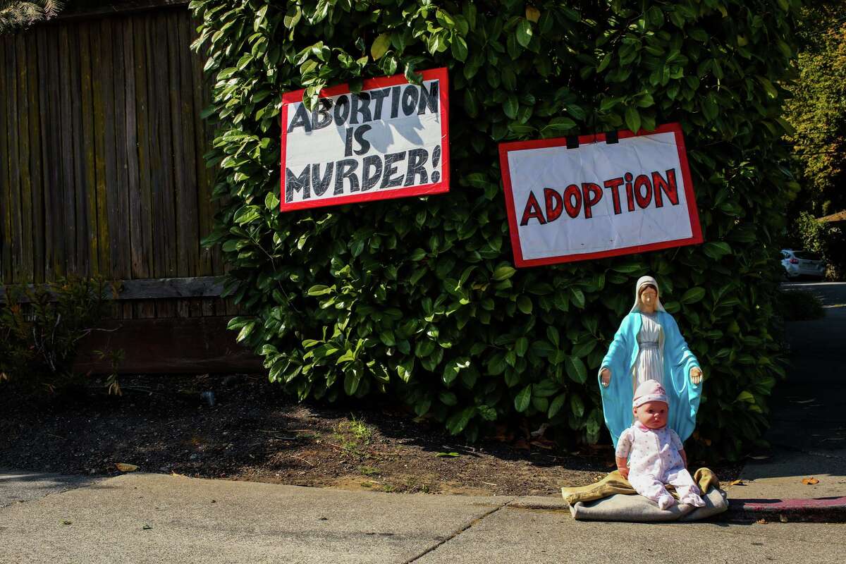 Protest signs are seen at the entrance to Planned Parenthood San Mateo in 2021. If the Supreme Court overturns Roe v Wade, it could embolden conservative communities across California that want to limit abortion services