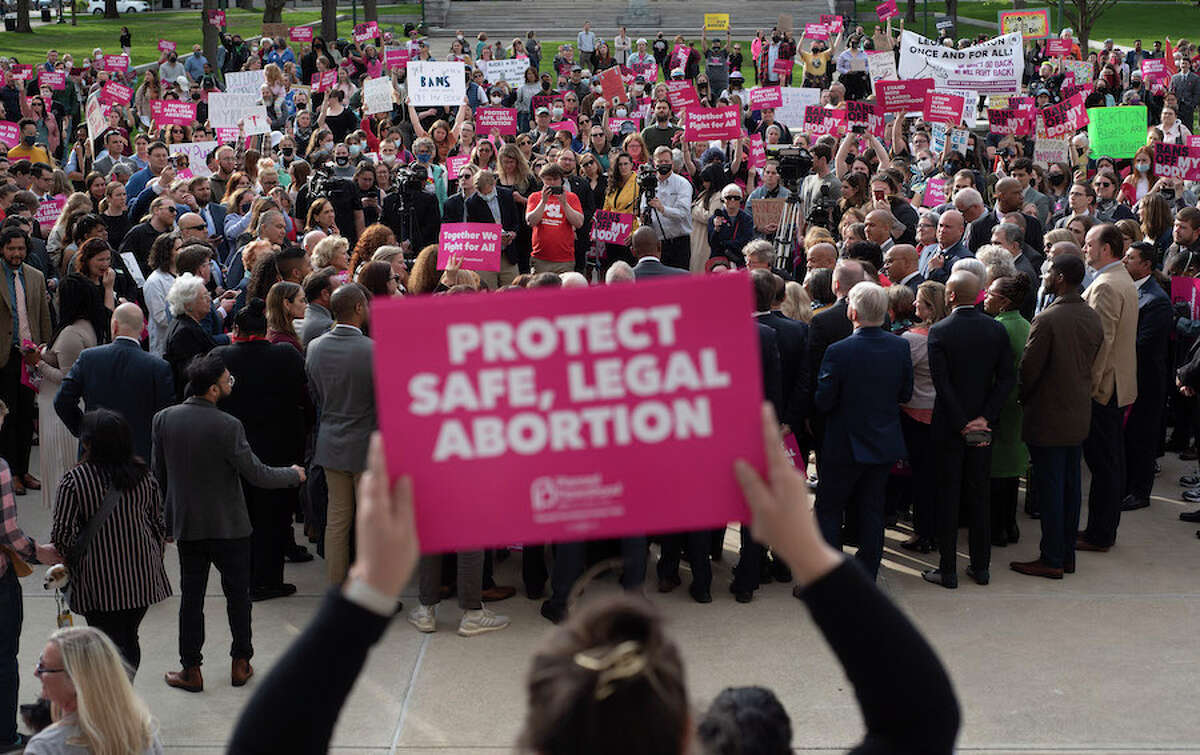 People gather on the west lawn of the state Capitol for a May 3 abortion rights rally as they listen to Gov. Kathy Hochul speak. (Paul Buckowski/Times Union)
