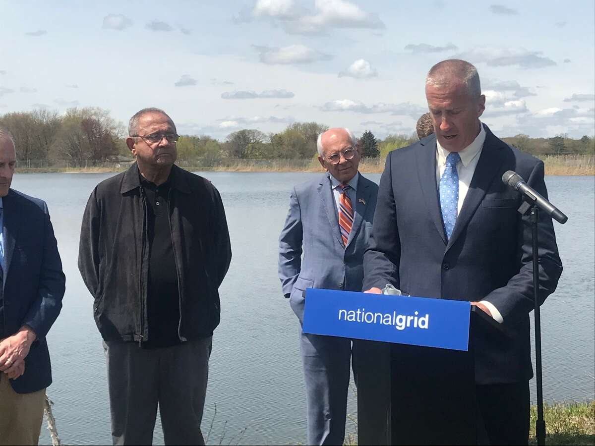 Cohoes Mayor Bill Keeler announces $750,000 grant from National Grid to help fund the city's floating solar array at the city reservoir Tuesday May 3, 2022 as Albany County Legislator Gil Ethier and U.S. Rep. Paul Tonko,, D-Amsterdam, listen.