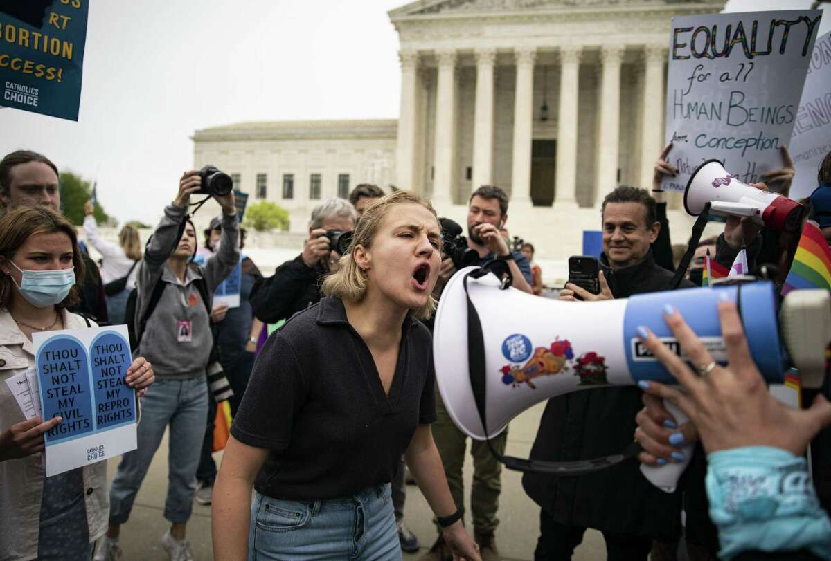 Demonstrators protest Tuesday outside the U.S. Supreme Court. Abortion rights suddenly emerged as an issue that could reshape the battle for control of Congress.