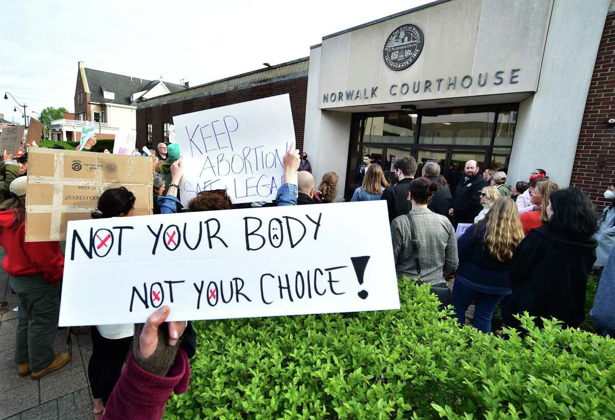 Dozens of area residents gather to take part in a pro-choice rally in front of the Norwalk Courthouse in downtown Norwalk, Conn., on Tuesday May 3, 2022. The rally was held to support abortion rights, following the leaked report that the Supreme Court intends to overturn Roe v. Wade.