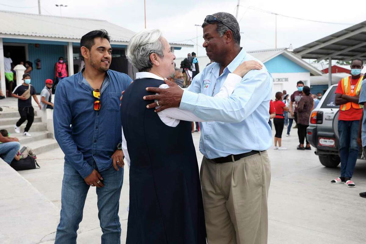 Sister Norma Pimentel, executive director of Catholic Charities of the Rio Grande Valley, hugs Senda de Vida founder Hector Silva at his nonprofit’s shelter on Tuesday. The two were at the shelter after the Mexican city of Reynosa shut down a migrant camp located at Plaza de la Republica, a few yards from the international crossing with Hidalgo, Texas.