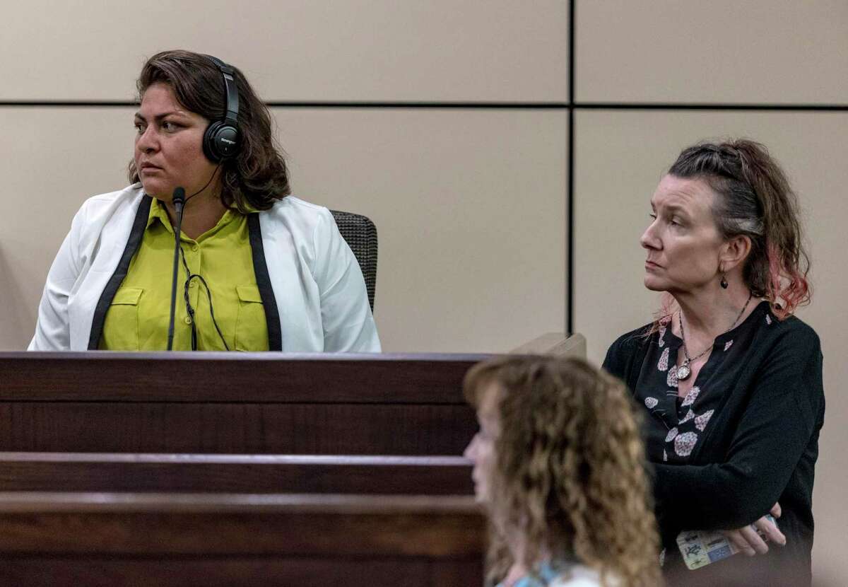 Defense witness Joanna Maldonado, left, listens Tuesday to the judge’s instructions, flanked by her attorney, Cathy Compton, in the murder-for-hire trial of Angelica Navarro-DePaz. Because Maldonado is in the country illegally, the judge appointed Compton to advise her.