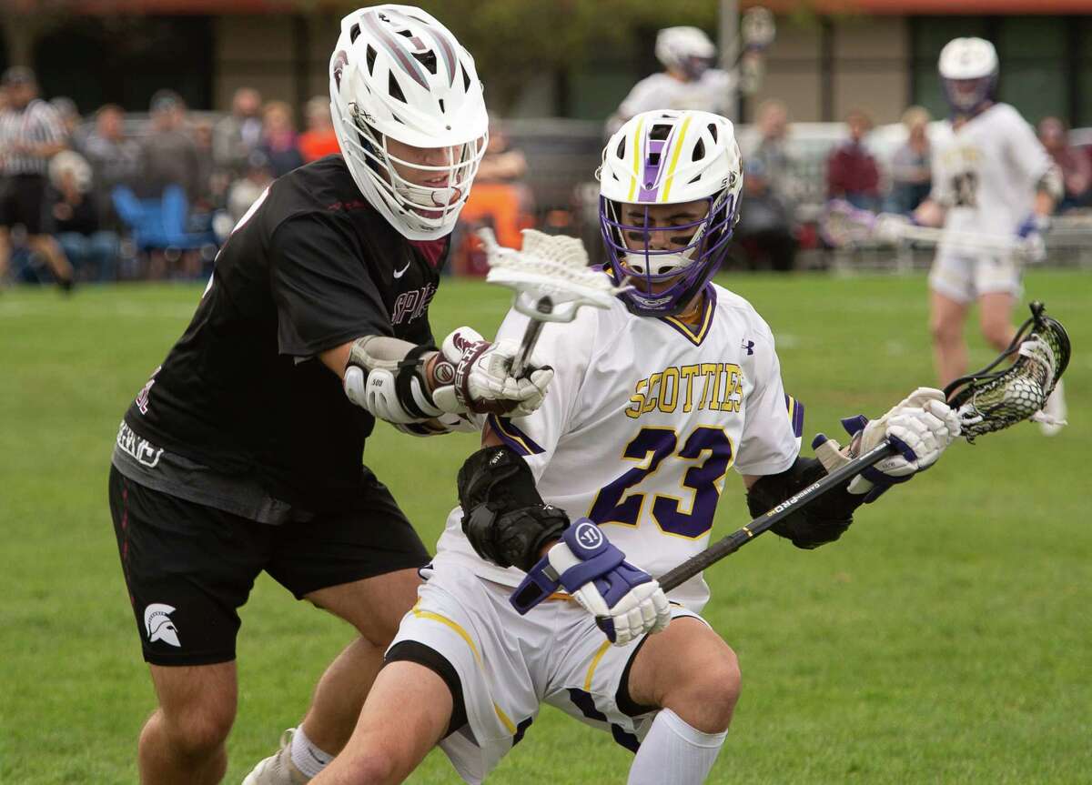 Burnt Hills-Ballston Lake midfielder Jake Pausley checks Ballston Spa middie Shawn Dywer during a game on Tuesday, May 3, 2022, in Ballston Spa, N.Y. (Jenn March, Special to the Times Union)