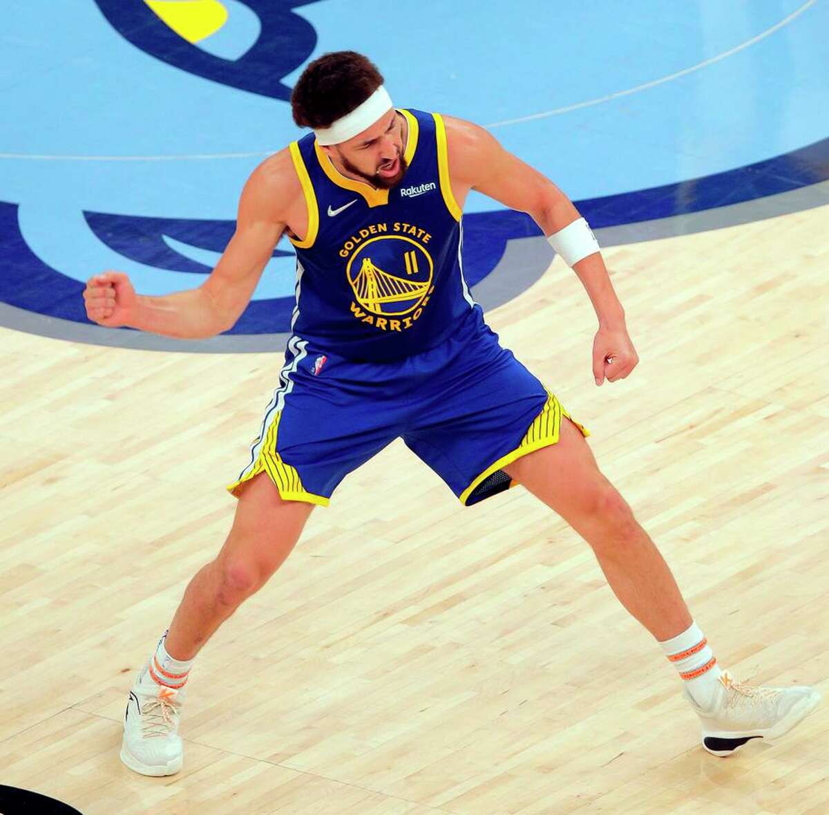 Klay Thompson (11) celebrates a three point shot made in the second half as the Golden State Warriors played the Memphis Grizzlies in Game 1 of the second round of the NBA Playoffs at Fedex Forum in Memphis, Tenn., on Sunday, May 1, 2022.