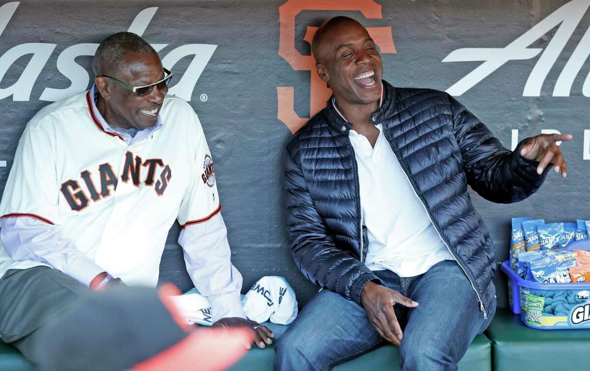 San Francisco Giants' greats Dusty Baker and Barry Bonds joke in dugout on African American Heritage Night before Giants play Chicago Cubs in MLB game at Oracle Park in San Francisco, Calif., on Tuesday, July 23, 2019.