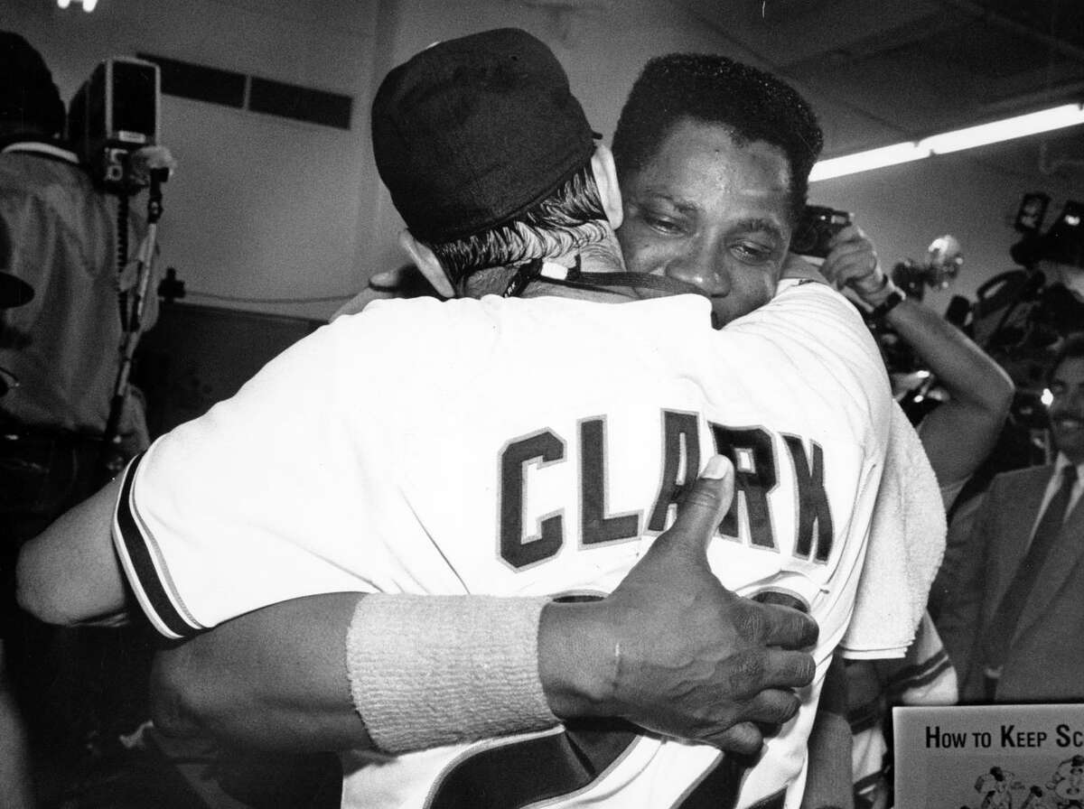 Giants first baseman Will Clark and then-hitting coach Dusty Baker hug at Candlestick Park after beating the Chicago Cubs in five games in the 1989 National League Championship Series.